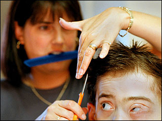 Debbie cuts Sam&rsquo;s hair