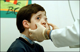 doctor examining Sam&rsquo;s face